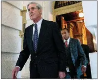  ?? AP/ANDREW HARNIK ?? Special counsel Robert Mueller (left) leaves Capitol Hill in June 2017 after a closed meeting with lawmakers. As Mueller appears to be nearing the end of his Russia investigat­ion, the House is calling for any final report from his team to be made public.