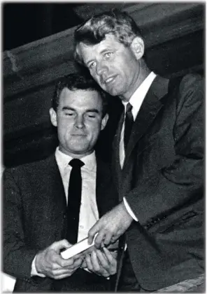  ??  ?? Ian Robertson and Robert Kennedy when they met in South Africa in 1966. The US senator was giving Robertson a gift of the book written by his brother, John F Kennedy.