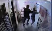  ?? COURTESY OF THE U.S. DEPARTMENT OF JUSTICE ?? Surveillan­ce footage captured Feb. 16during an armed robbery at Lucky Health Therapy, a Torrance massage parlor. Two men are accused of robbing the parlors.