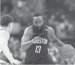  ??  ?? Rockets guard James Harden won his first scoring title while leading the Rockets to a league-best 65-17 record.