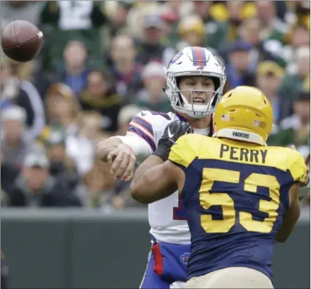  ?? JEFFREY PHELPS - THE ASSOCIATED PRESS ?? Buffalo Bills’ Josh Allen throws around Green Bay Packers’ Nick Perry during the first half of an NFL football game Sunday, Sept. 30, 2018, in Green Bay, Wis.