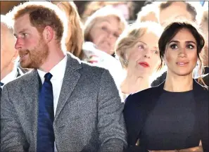  ??  ?? TENSE: Harry, top, wearing his ‘smart’ ring, circled and inset, gets reassuranc­e from Meghan but, left, still grinds his teeth and fidgets, above