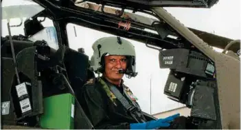  ??  ?? (Top) President Ram Nath Kovind presents colours to the Army Aviation Corps on October 10, 2019, in a ceremonial parade, held at Army Aviation Base, Nashik; (above) DG in the cockpit of Apache.