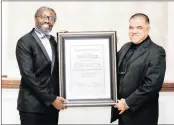  ?? PICTURE: JENNA FINKELSTEI­N ?? FATHER’S HONOUR: Faizel Moosa, right, accepts the Sydney and Felicia Kentridge Award on behalf of his late father, Judge Essa Moosa, from Vuyani Ngalwana SC, chairperso­n of the General Council of the Bar.
