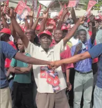  ?? THONY BELIZAIRE / AFP / GETTY IMAGES ?? Supporters of presidenti­al candidate Evans Paul demonstrat­e last week in Port-au-Prince. Only about 2.8 million of an estimated 4.5 million potential Haitian voters have registered to cast ballots.