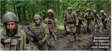  ?? ?? Reclaimed: The fighters in a forest near Kharkiv