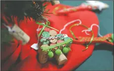  ?? BEA AHBECK/NEWS-SENTINEL ?? A Christmas ornament made out of wine corks as seniors sell their handmade jewelry and Christmas ornaments at Fairmont Rehabilita­tion Hospital in Lodi on Friday. The money raised will go to Lodi House.