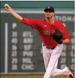  ?? STUART CAHILL / BOSTON HERALD ?? Red Sox pitcher Garrett Whitlock throws in the first inning against the Reds at Fenway Park on Wednesday night.