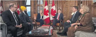  ?? ADRIAN WYLD THE CANADIAN PRESS ?? The Green Party’s Elizabeth May, right, said nothing new came of the meeting with Mario Beaulieu of the Bloc Québécois, left, the NDP’s Jagmeet Singh, official languages minister Mélanie Joly, PM Justin Trudeau and the Tories’ Andrew Scheer.