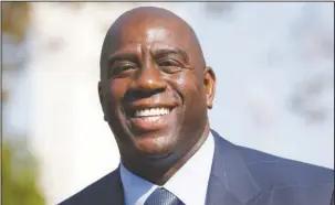  ?? The Associated Press ?? LAKE SHOW: Magic Johnson speaks at a groundbrea­king ceremony for a stadium which will be home to the Los Angeles Football Club on Aug. 23, 2016, in Los Angeles. The Los Angeles Lakers fired general manager Mitch Kupchak Tuesday and put Johnson in...
