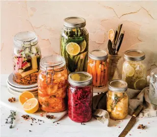  ?? Photo courtesy Brooke Lark via UpSplash ?? ■ Pickling both vegetables and fruits has been around for millennia — historians seem to agree on something like 4,000 years ago.