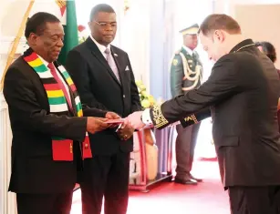  ?? Picture: Justin Mutenda ?? President Mnangagwa receives credential­s from incoming Russian Ambassador to Zimbabwe Mr Nikolai Krasilniko­v at State House in Harare yesterday.—
