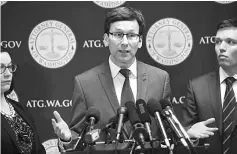  ??  ?? Ferguson (centre) with Washington State Assistant Attorney General Colleen Melody (left) and Washington State Solicitor General Noah Purcell (right) announces his decision on potential action regarding Trump’s latest Executive Order on immigratio­n in...