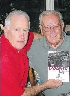  ??  ?? Robb Lucy and his dad Bob with the book of 24 stories from his war experience, Ubique: a Gunner’s Story.