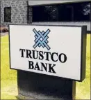  ??  ?? Cindy Schultz / Times Union archive Trustco Bank is fighting a suit challengin­g overdraft fees.