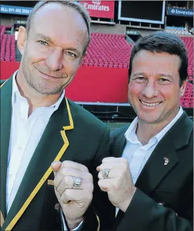  ?? Picture: GALLO IMAGES ?? WINNING SMILES: Former Springbok captain Francois Pienaar, left, and centre Hennie le Roux show off their commemorat­ive championsh­ip rings during celebratio­ns to mark the 20th anniversar­y of the Boks’ Rugby World Cup victory at Ellis Park in...