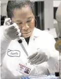  ?? Mayra Beltrán / Houston Chronicle ?? Microbiolo­gist Juanita Sumpter tests for salmonella in the microbiolo­gy lab at the Houston Health and Human Services Department last week.