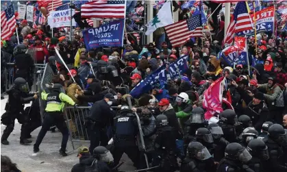  ?? Photograph: Roberto Schmidt/ AFP/Getty Images ?? Trump supporters clash with police and security forces at the Capitol in Washington DC on January 6, 2021.