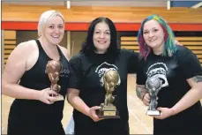  ??  ?? Above: Ladies trophy winners, left to right, Izzy Tait, third, Pavlina Peru Thomson, first, and Dovile Bartkute, second.