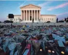  ?? JOSE LUIS MAGANA/AFP VIA GETTY IMAGES ?? People pay their respects to the late Associate Justice Ruth Bader Ginsburg in Washington, D.C., on Saturday.