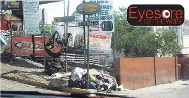  ?? CONTRIBUTE­D ?? Civic pride appears to be at an all-time low among the businesses operating in the vicinity of the Montego Bay No. 2 post office, popularly known as ‘Clock’. The garbage seen covering the foot of the signpost is positioned in front of three...