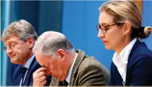  ??  ?? Turmoil: AfD leaders Joerg Meuthen, left, Alexander Gauland and Alice Weidel react as MP Frauke Petry, right, quits yesterday