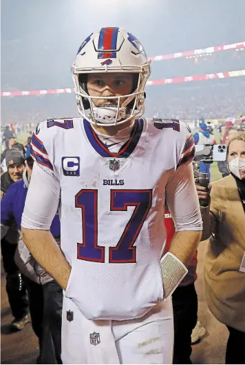  ?? DAVID EULITT
GETTY IMAGES ?? Josh Allen walks off the field after being defeated by the Kansas City Chiefs in the AFC divisional playoff game Sunday. Allen was 27 of 37 for 329 yards passing and four touchdowns without an intercepti­on.