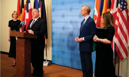  ??  ?? Mike Pompeo is flanked by the US ambassador to the United Nations, Kelly Craft, and US specialrep­resentativ­e for Iran, Brian Hook, as he speaks to reporters following a meeting with members of the UN security council. Photograph: Mike Segar/AFP/Getty Images