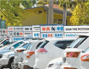  ?? @falundafa_australia / Instagram ?? A row of cars bearing anti-Chinese Communist Party slogans.