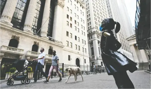  ?? JOHANNES EISELE / AFP via Gett y Images files ?? Quarantine time has got investment columnist Peter Hodson (and his two teenage sons) thinking about some of the possible deals that are out there to be made on Wall Street, above, or the TSX.