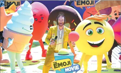  ?? ARTHUR MOLA / ASSOCIATED PRESS ?? Actor T.J. Miller poses with characters southern France, on May 16. during the photo call for The Emoji Movie at the 70th internatio­nal film festival in Cannes,