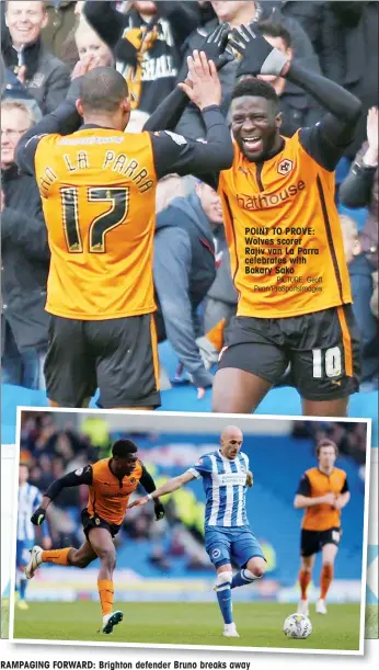  ?? PICTURE: Geoff Penn/ProSportsI­mages ?? POINT TO PROVE: Wolves scorer Rajiv van La Parra celebrates with Bakary Sako
RAMPAGING FORWARD: Brighton defender Bruno breaks away