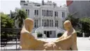  ??  ?? This picture taken on August 8, 2020 shows a view of “The Weeping Women’ sculpture, depicting a Christian and Muslim woman mourning together in the loss of sons to war, in the courtyard of the damaged Sursock Museum in the neighborho­od of Ashrafiyeh in Lebanon’s capital Beirut.