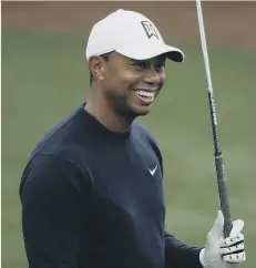  ??  ?? Tiger Woods enjoys his build-up to the Masters in Augusta.