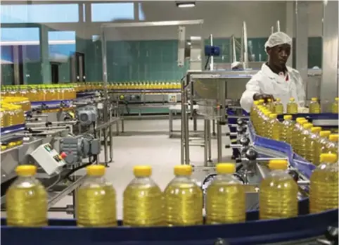  ?? ?? A workman goes about his duties in a cooking oil factory in Harare recently