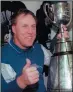  ?? THE CANADIAN PRESS/ TOM HANSON ?? Don Matthews poses with the Grey Cup following his Baltimore Stallions’ 37-20 victory over the Calgary Stampeders in Regina in 1995. The Hall of Famer died Wednesday at the age of 77.