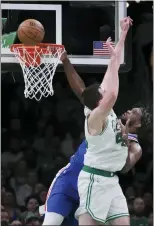  ?? CHARLES KRUPA — THE ASSOCIATED PRESS ?? Joel Embiid, rear, is blocked on a dunk attempt against Boston’s Luke Kornet during the first half on Wednesday.