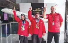  ?? Courtesy: Etihad ?? Special Olympics athletes Hamda Al Hosni (from left), Saleh Al Merri and Butti Al Shizawi during the launch of the initiative.