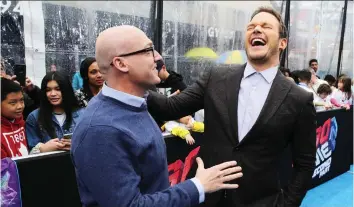  ?? SARAH MORRIS/GETTY IMAGES ?? The Lego Movie 2: The Second Part co-director Mike Mitchell, left, seen with star Chris Pratt, says the movie required twice the directing — once for the voice actors, then for the animators.
