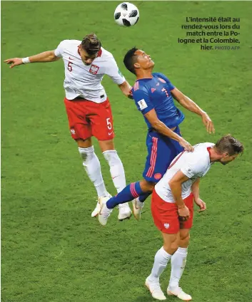  ?? PHOTO AFP ?? L’intensité était au rendez-vous lors du match entre la Pologne et la Colombie, hier.