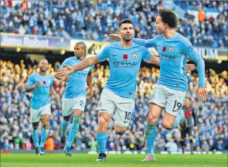  ?? REUTERS ?? Striker Sergio Aguero (2nd from right) scored Manchester City’s second goal from the spot against Arsenal in the Premier League on Sunday .