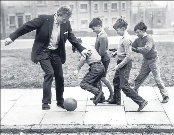  ??  ?? Denis Law, pictured enjoying a kickabout with Aberdeen schoolboys during his playing pomp, has always been proud of his north-east roots