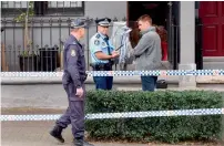  ?? AFP ?? Police stand guard outside a house in the inner Sydney suburb of Surry Hills on Sunday, after a raid in a major joint counterter­rorism operation.—
