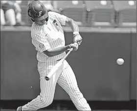  ?? AP/Lubbock Avalanche-Journal/BRAD TOLLEFSON ?? Florida’s Kendrick Calilao hits a two-run home run against Army in an NCAA regional game Saturday in Lubbock, Texas. Calilao drove in five runs as the Gators won 13-5.