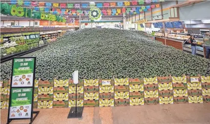  ?? PROVIDED BY EL RIO GRANDE LATIN MARKET ?? This spectacle at El Rio Grande Latin Market in Dallas is anything but the pits. Its 301,000 avocados, nearly 87,000 pounds of them, set a Guinness World Record this month for largest fruit display.