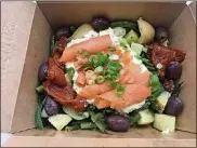  ?? LIGAYA FIGUERAS / LFIGUERAS@AJC.COM. ?? The star of the Ole Reliable lunch menu is the smoked salmon salad niçoise, a feel-good mélange of potatoes, green beans, kalamata olives, preserved tomatoes and cucumber, with a layer of egg salad and smoked salmon rolls garnished with scallions.