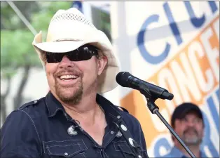  ?? ASSOCIATED PRESS PHOTOS ?? Country music recording artist Toby Keith performs on NBC’s Today show at Rockefelle­r Plaza on Friday, July 5, 2019, in New York. Keith, the Country music singer-songwriter has died. A statement posted on his website says Keith, who was battling stomach cancer, died peacefully Monday surrounded by his family.