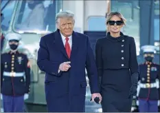  ?? Alex Edelman / Getty Images ?? Outgoing President Donald Trump and first lady Melania Trump step out of Marine One at Joint Base Andrews in Maryland on Wednesday. The couple later flew to their Mar-a-lago golf club residence in Palm Beach, Fla.