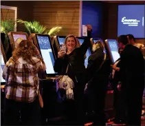  ?? NANCY LANE — MEDIANEWS GROUP/BOSTON HERALD ?? A woman shows off her receipt as the first sports bets are placed at the Encore Boston Harbor casino on Jan. 31, 2023 in Everett.