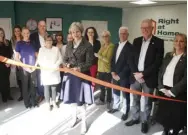  ??  ?? Above: Prime Minister Theresa May cuts the ribbon to declare the new Twyford offices of Right At Home open. Left, Mrs May with Kevin Lancaster (Managing Director) and Bailey Harrison (Registered Care Manager) of Right at Home Reading & Wokingham...